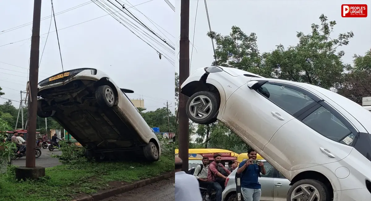 बेकाबू कार बिजली के पोल से टकराकर हवा में लटकी, तस्वीरें देख हर कोई हैरान